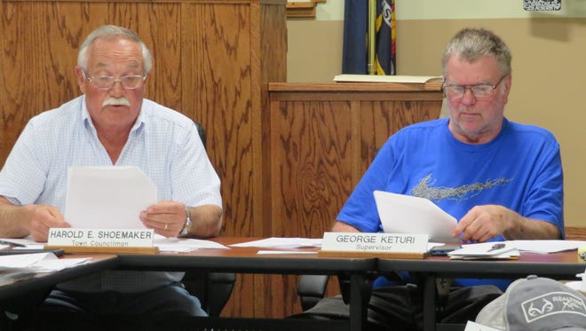 Harold Shoemaker, left, Town of Van Etten supervisor, and George Keturi, Town of Van Etten supervisor, examine the Village of Van Etten budget numbers at a town board meeting Friday, May, 11, 2018. The town is examining the impact of the pending dissolution of the Village of Van Etten.