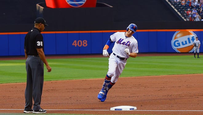 New York Mets left fielder Brandon Nimmo (9) rounds the bases after hitting a solo home run against the New York Yankees during the first inning at Citi Field.