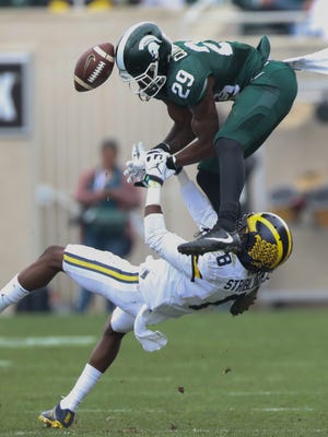 Michigan Wolverines cornerback Channing Stribling defends against Michigan State Spartans receiver Donnie Corley during the fourth quarter Saturday, Oct. 29, 2016 at Spartan Stadium in East Lansing.