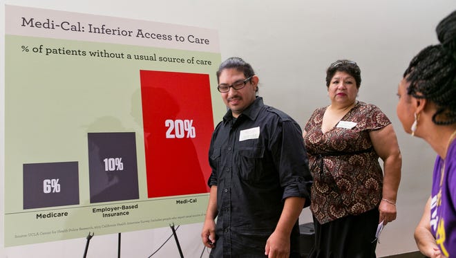 Plaintiffs Saul Jimenez Perea, and his mother, Analilia, arrive at a news conference to announce a suit filed by attorneys with the Mexican American Legal Defense and Educational Fund, commonly known as MALDEF, and the Civil Rights Education and Enforcement Center in Los Angeles on Wednesday.