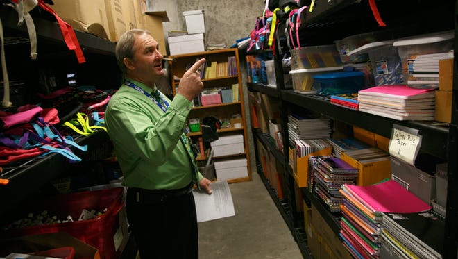 Washington County School District Homeless Liaison and Student Support Services Coordinator Mike Carr points out the various donated items he has available for students in need stored in the basement of the district's offices.