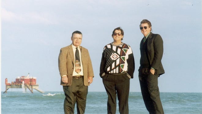 In this December 2000 photo, Gordon "Stumpy Harris, left, Jack Kirschenbaum, center, and J. Mason Williams stand on Cocoa Beach. The three attorneys fought the Army Corp of Engineers for more than a decade to pay for a beach restoration project and compensate hundreds beachfront homeowners for erosion caused when the Corps dredged Port Canaveral.

-Text: dredge 12/24 8a
