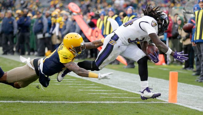 Baltimore Ravens defensive back Jaylen Hill (43) scores a touchdown asGreen Bay Packers free safety Ha Ha Clinton-Dix (21) tries to tackle during the 4th quarter of the Green Bay Packers 23-0 loss to the Baltimore Ravens at Lambeau Field in Green Bay, Wis. on Sunday, November 19, 2017.