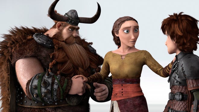 This image released by DreamWorks Animation shows characters, from left, Stoick, voiced by Gerard Butler, Valka, voiced by Cate Blanchett and Hiccup, voiced by Jay Baruchel, in a scene from "How To Train Your Dragon 2."