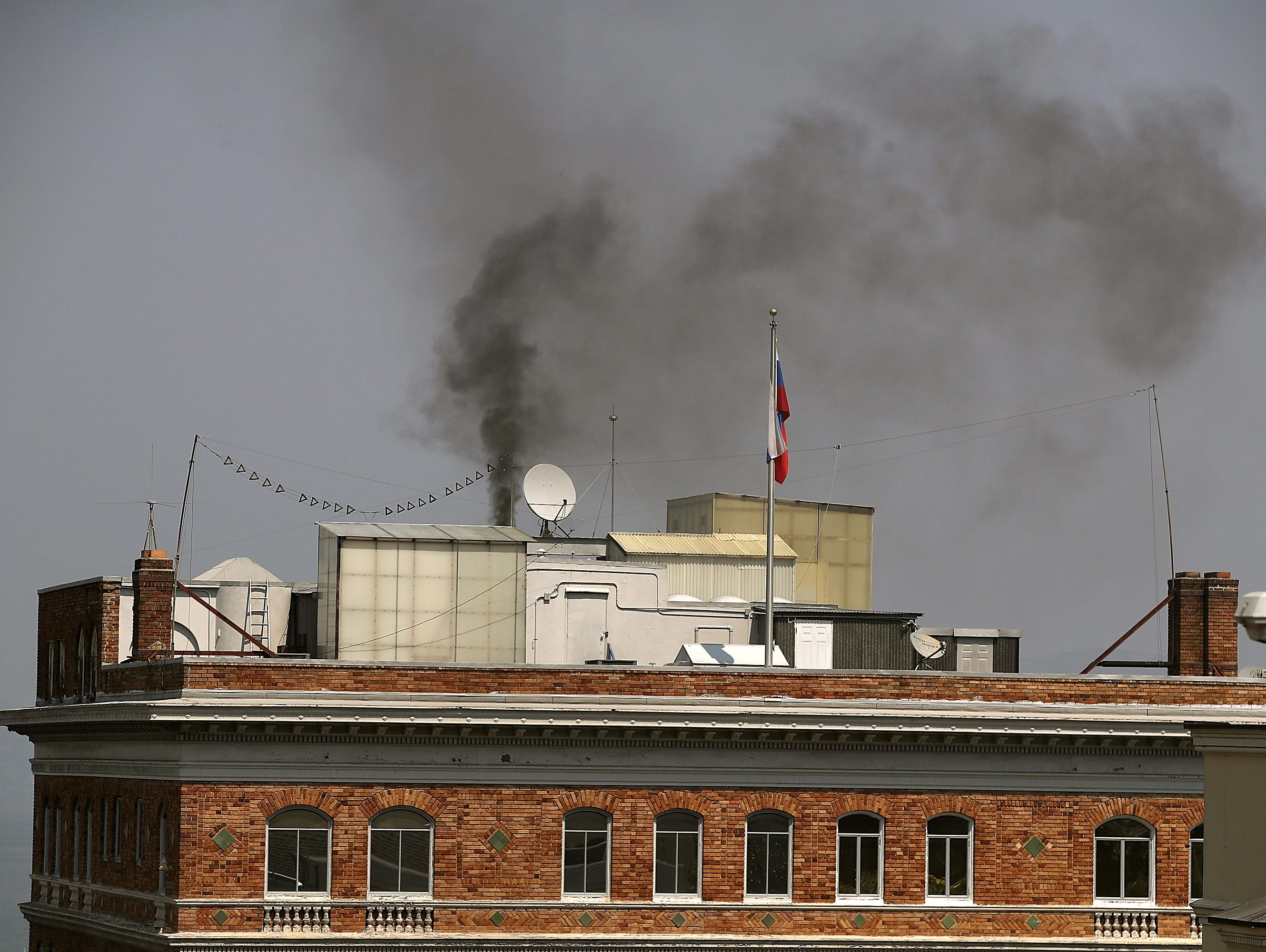 Black smoke billows from a chimney on top of the Russian consulate on September 1, 2017 in San Francisco, California. In response to a Russian government demand for the United States to cut its diplomatic staff in Russia by 455, the Trump administrat