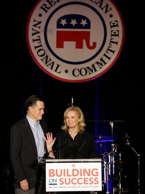 Mitt Romney shares the stage with his wife Ann before addressing the Republican National Committee's winter meeting aboard the USS Midway Museum on Jan. 16, 2015, in San Diego.