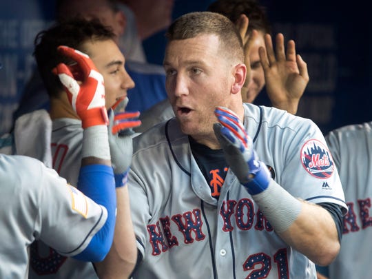 New York Mets' Todd Frazier is congratulated in the