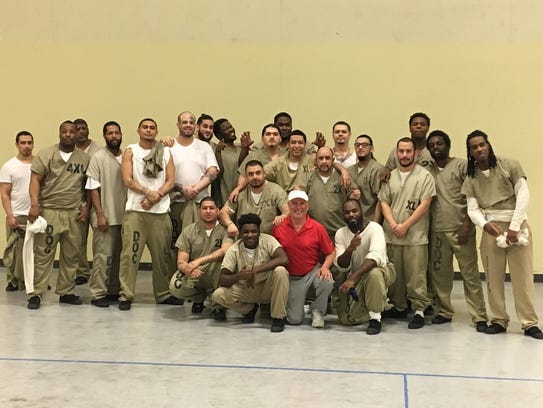 Prisoners from Cook County Jail pose wit pickleball