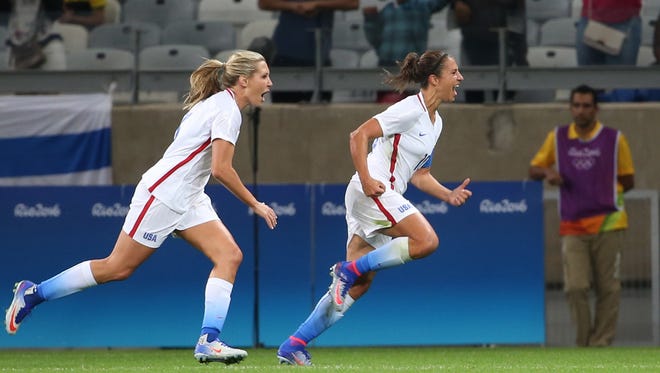United States' Carli Lloyd, right, celebrates after scoring against New Zealand during a Women's Olympic Football Tournament match at the Mineirao stadium in Belo Horizonte, Brazil, Wednesday, Aug. 3, 2016. (AP Photo/Eugenio Savio)