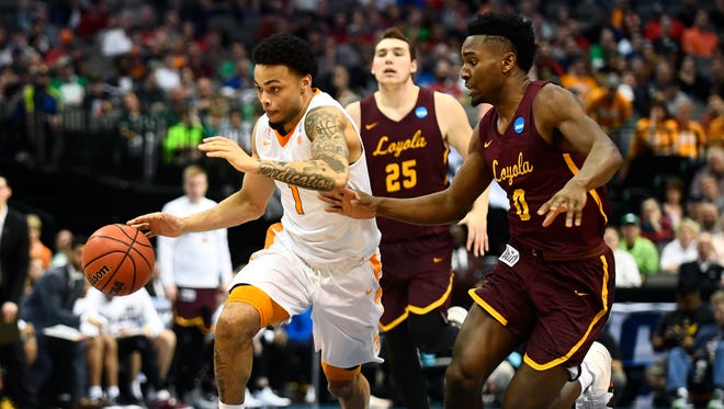 Tennessee guard Lamonte Turner (1) drives past Loyola Chicago guard Donte Ingram (0) during an NCAA tournament second-round game March 17.