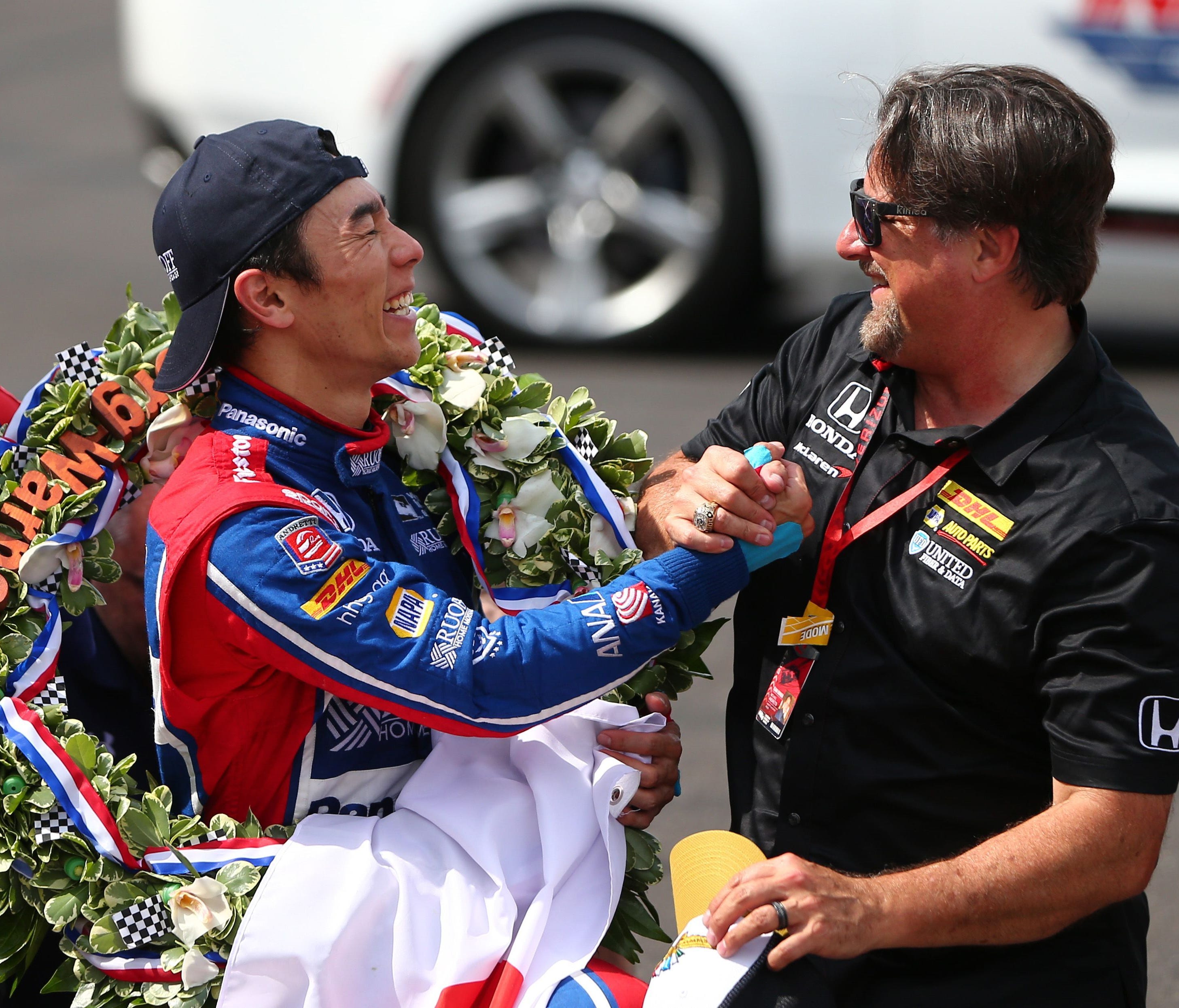 IndyCar Series driver Takuma Sato (left) celebrates with team owner Michael Andretti (right) after winning the 101st Running of the Indianapolis 500 at Indianapolis Motor Speedway.