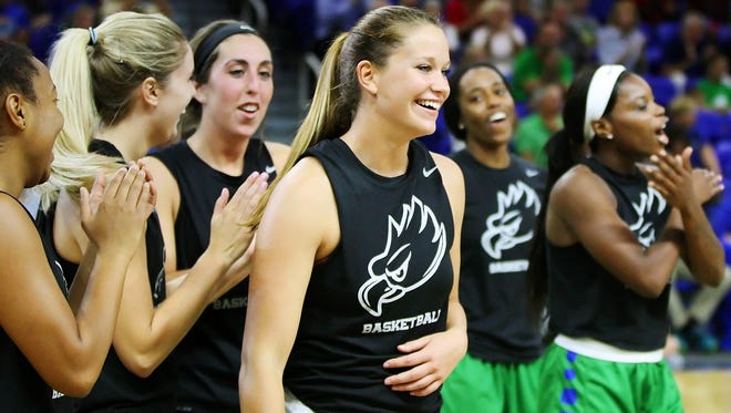 FGCU's Taylor Gradinjan, center, celebrates winning the 3-point contest Friday at the Dunk City After Dark event at Alico Arena in Fort Myers.