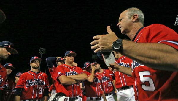 Mike Bianco talks to his team after a win against Mississippi State.