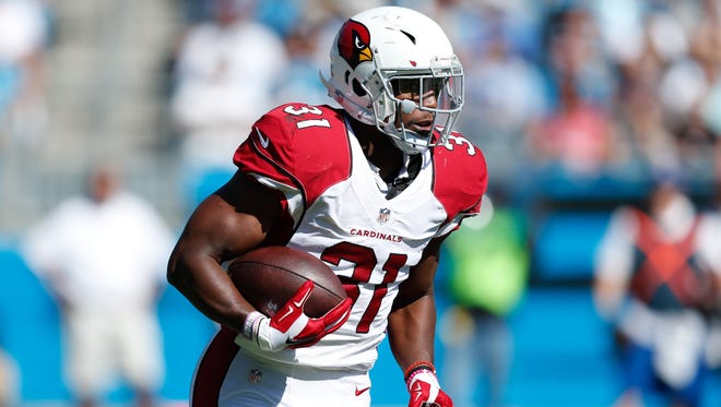 Cardinals running back David Johnson runs during the second quarter against the Panthers at Bank of America Stadium.