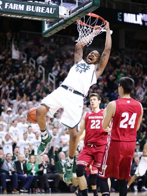 Michigan State's Nick Ward dunks during the first half of MSU's 84-74 win over Wisconsin on Sunday, Feb. 26, 2017 in East Lansing.