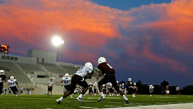 Missouri State Bears cornerback Matt Rush (4) tackles wide receiver Willis Chamber (6) during a Missouri State Bears intra-squad scrimmage held at Robert W. Plaster Stadium in Springfield, Mo. on Aug. 17, 2016.