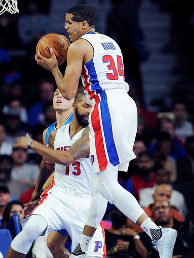 Pistons' Tobias Harris grabs a rebound in the first