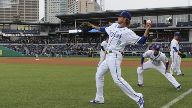 In this April 13, 2017 file photo, Hartford Yard Goats players warm up before the team's first ever game in Hartford, Conn.