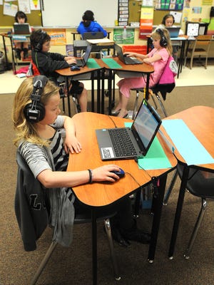 Third-grade students practice for the state’s new Badger Exam on April 15, 2015, at Friendship Learning Center in North Fond du Lac.