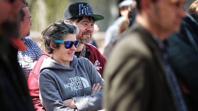 Local filmmaker Sarah Fleming, left, and artist Christopher Reyes join the crowd as members of the Memphis creative community gather for a rally in Civic Center Plaza to support the couple in their dispute with the Madison Hotel.