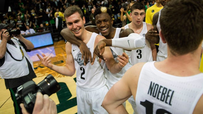 Jan 21, 2017; Eugene, OR, USA; Oregon Ducks guard Casey Benson (2) and guard Dylan Ennis (31) celebrate after a game against the Stanford Cardinals at Matthew Knight Arena. The Oregon Ducks won 69-52. Mandatory Credit: Troy Wayrynen-USA TODAY Sports