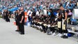 Saints players sit during the national anthem in Week