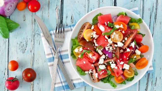 Watermelon and mixed tomato salad with feta cheese is perfect for a warm day.