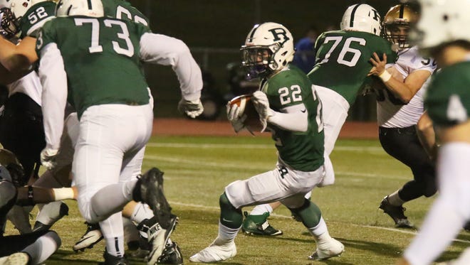From 2016:  Ramapo's #22 RB Shane Brancaleone breaks through the line against River Dell in the state playoffs.