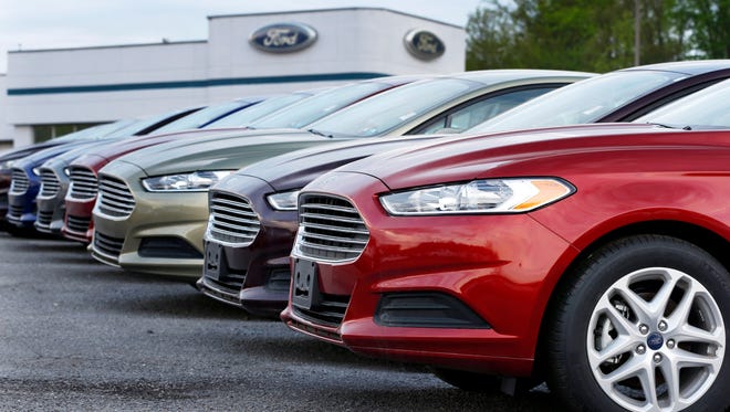 A row of new Ford Fusions is seen at an automobile dealership in Zelienople, Pa., in this 2013 file photo