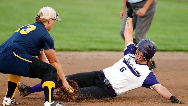 Fowlerville's Ginelle Leslie, shown sliding, hit a walk-off homer in the first game and another homer in the second game in a sweep of St. Johns.