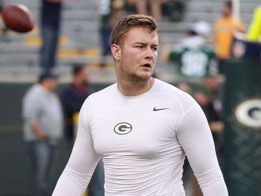 Green Bay Packers long snapper Taybor Pepper warms