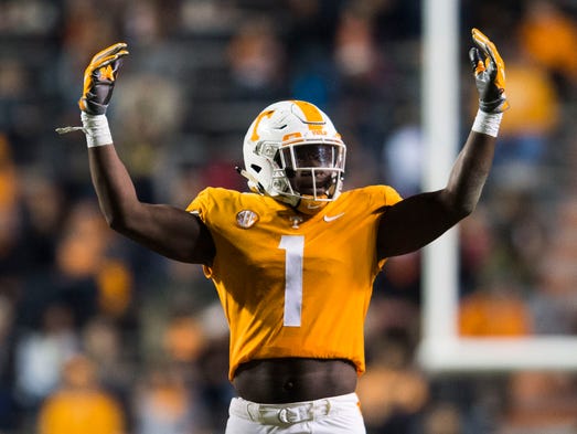 Tennessee defensive lineman Jonathan Kongbo (1) raises