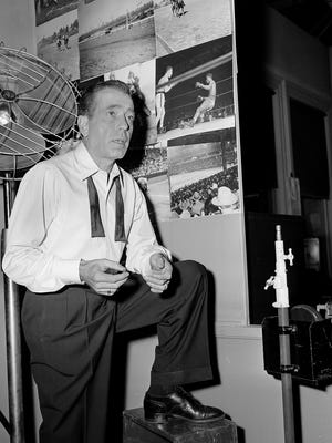 Humphrey Bogart takes a short break from filming "Deadline:  U.S.A." in Hollywood, California on Dec. 18, 1951.