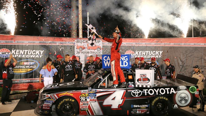 Christopher Bell celebrates after winning the NASCAR Trucks auto race, early Friday, July 7, 2017, at Kentucky Speedway in Sparta, Ky. (Kareem Elgazzar//The Cincinnati Enquirer via AP)