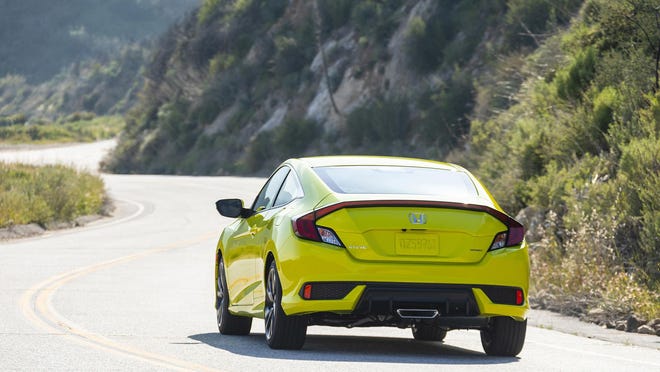The 2019 Honda Civic Coupe Sport's restyled lower bumper gives Civic a wider look and is complemented by a blacked-out headlight treatment.