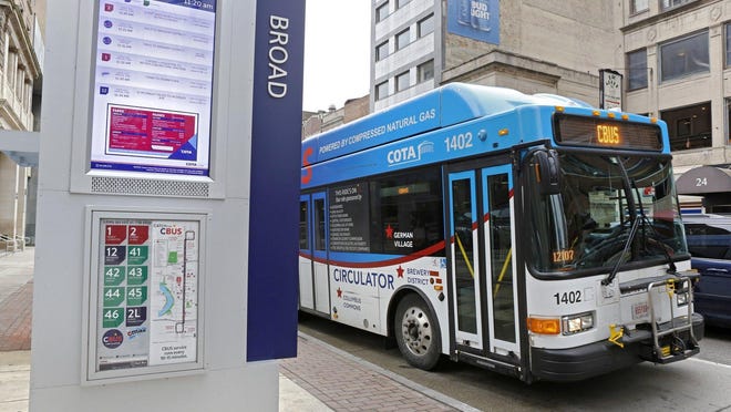 COTA's C-bus circulator travels down High Street in March.  [Barbara J. Perenic/Dispatch)