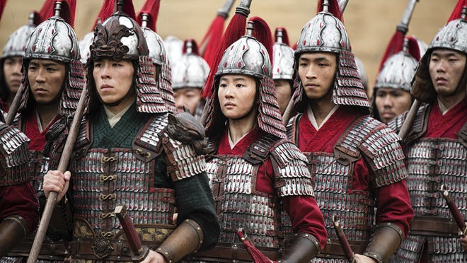 Mulan (Yifei Liu, center) does her best to mix in with the guys.
