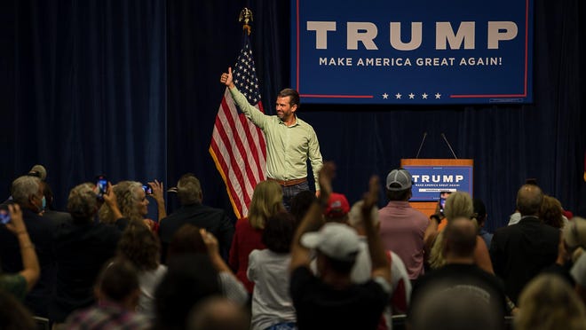 Donald Trump, Jr gives a thumbs up to the crowd after speaking Wednesday night at the Savannah Convention Center.