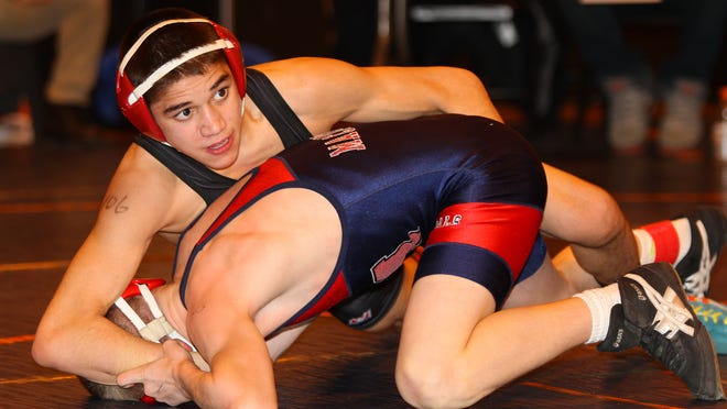 Hilton’s Yianni Diakomihalis, top, is ranked No. 1 in the country at 106 pounds heading into the state championships.