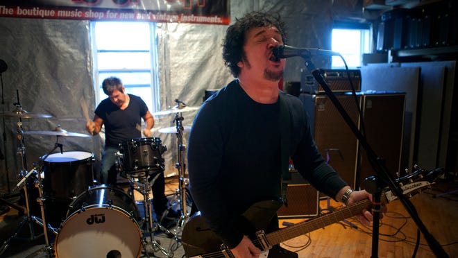 Wally Palmar sings and Clem Burke drums as The Empty Hearts perform in a practice space in Fairport on Wednesday, October 8, 2014.