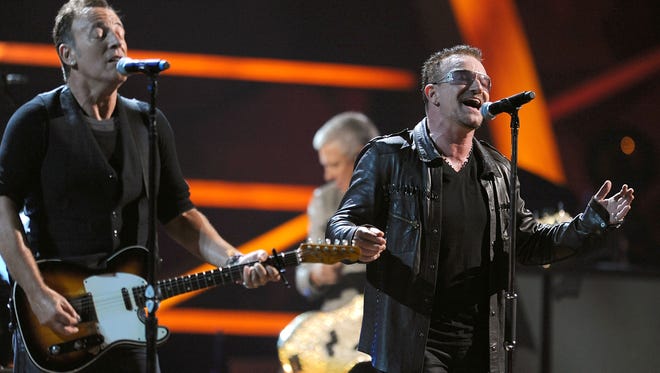 Bruce Springsteen and Bono perform onstage at the 25th Anniversary Rock & Roll Hall of Fame Concert at Madison Square Garden on October 30, 2009 in New York City.