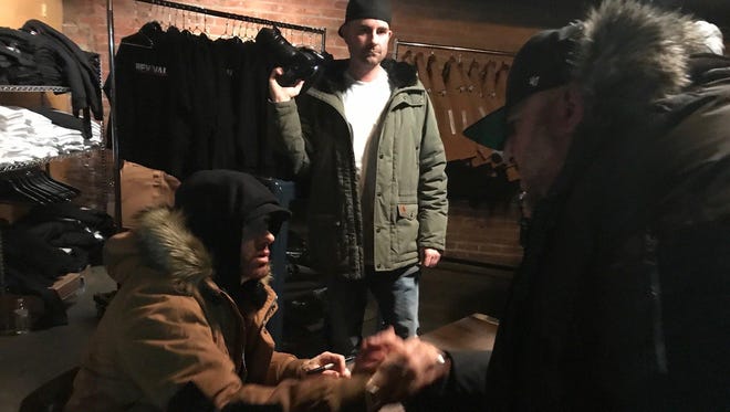 Detroit rapper Eminem stopped by his pop-up shop at The Shelter on Friday afternoon to greet fans and sign autographs.