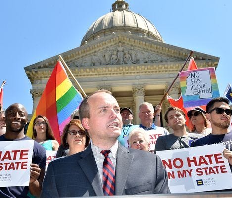 Rob Hill, State Director for Human Rights Campaign, speaks on the steps of the Capitol in downtown Jackson.