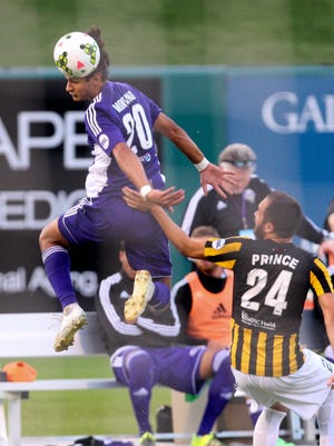 Louisville City FC's Enrique Montano keeps the ball in play against Charleston's Zachary Prince. LCFC beat Charleston, Saturday's playoff opponent, during a Aug. 22 game at Slugger Field.