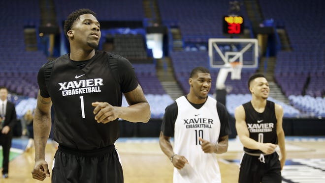 Xavier's Jalen Reynolds (left), Remy Abell and Larry Austin Jr. warm up before Thursday's practice in St. Louis.