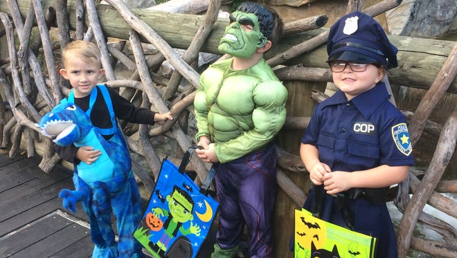 My dinosaur nephew, Hulk of a son and Sgt. Po-Po pose for a photo at Nashville's Boo at the Zoo event.