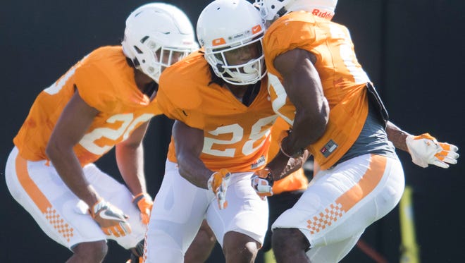 Tennessee's Baylen Buchanan, center, participates in a drill during a Vols football practice Tuesday.