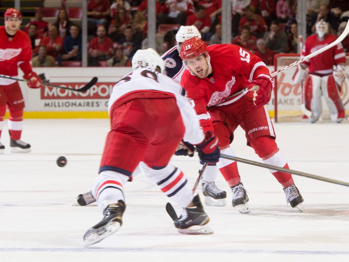 Detroit center Riley Sheahan tries to get the puck