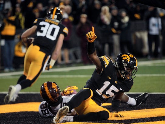 Iowa's Josh Jackson celebrates as Jake Gervase picks