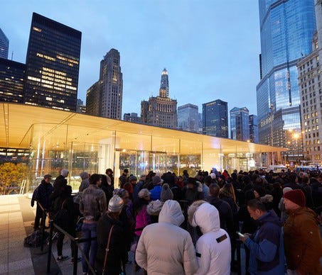 Apple customers wait in line at an Apple store to buy the iPhone X on Nov. 3.